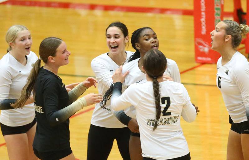 Members of the Sycamore volleball team react after winning the second set against L-P on Tuesday, Sept. 23, 2025 in Sellett Gymnasium at L-P High School.