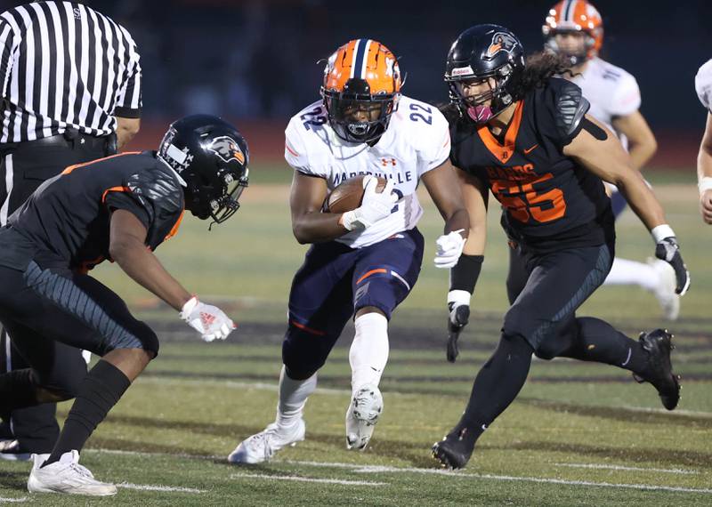 Naperville North's Lonzo Duckworth tries to get between DeKalb’s Davon Grant (left) and Julian Gomez during their game Friday, Sept. 22, 2023, at DeKalb High School.