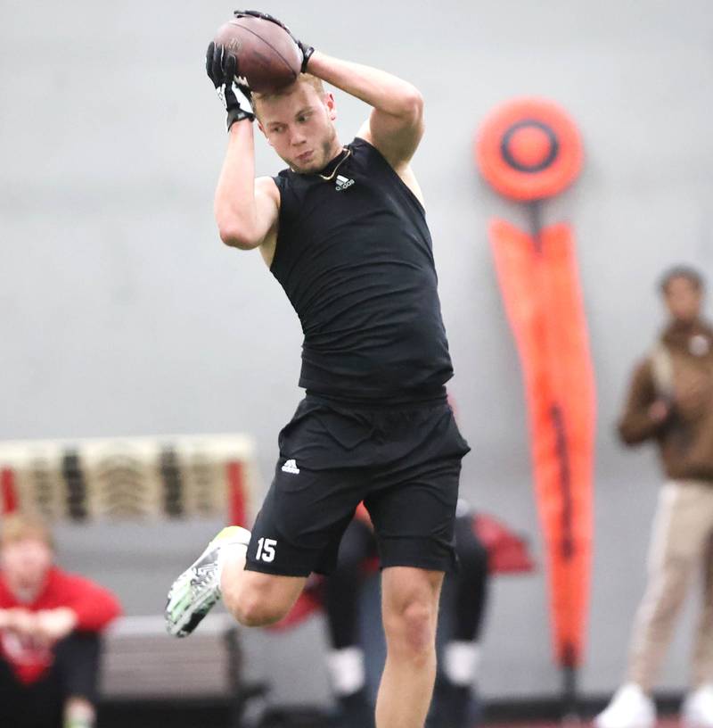 Former Northern Illinois University receiver Cole Tucker, from DeKalb, makes a leaping catch Thursday, March 23, 2023, during pro day in the Chessick Practice Center at NIU. Several NFL teams had scouts on hand to evaluate players ahead of the upcoming draft.