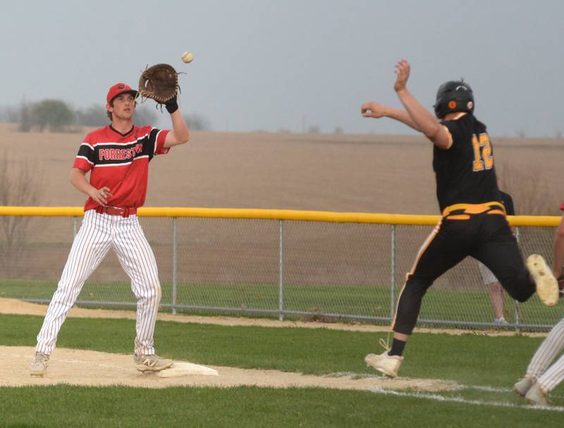 Forreston's Alec Schoonhoven waits for the throw to first for an out against Lena-Winslow on Monday, April 28, 2025 at Forreston High School.