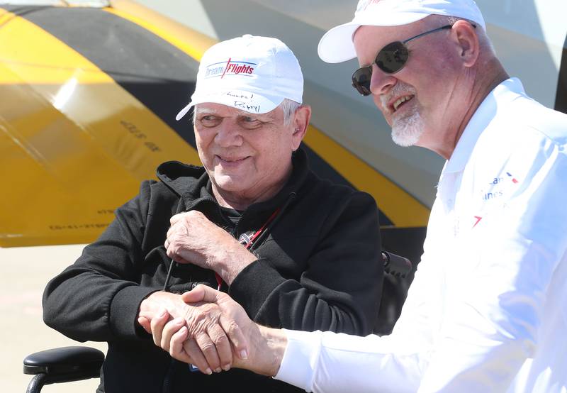 Ed Manahan of Princeton, shakes pilot Darryl Fishers hand  after flying in a 1942 Boeing Stearman A-75 Primary Trainer during a Veteran Dream Flight on Tuesday, Sept 2, 2025 at the Illinois Valley Regional Airport in Peru.