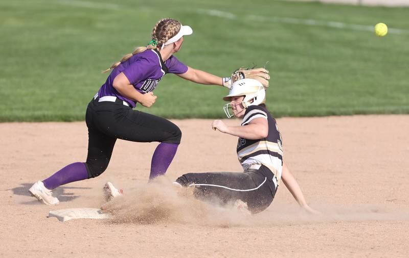 Sycamore's Brooklynn Snodgrass slides safely into second as Dixon's Sam Tourtillott takes the throw during their game Thursday, May 12, 2022, at Sycamore High School.