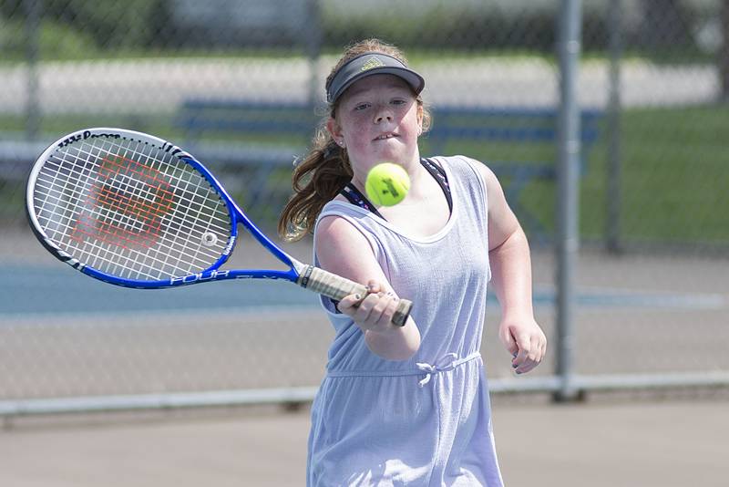 Josie Rhodes returns a shot while playing in the 11 and under girls singles at the Emma Hubbs tennis classic Thursday, July 26, 2022.