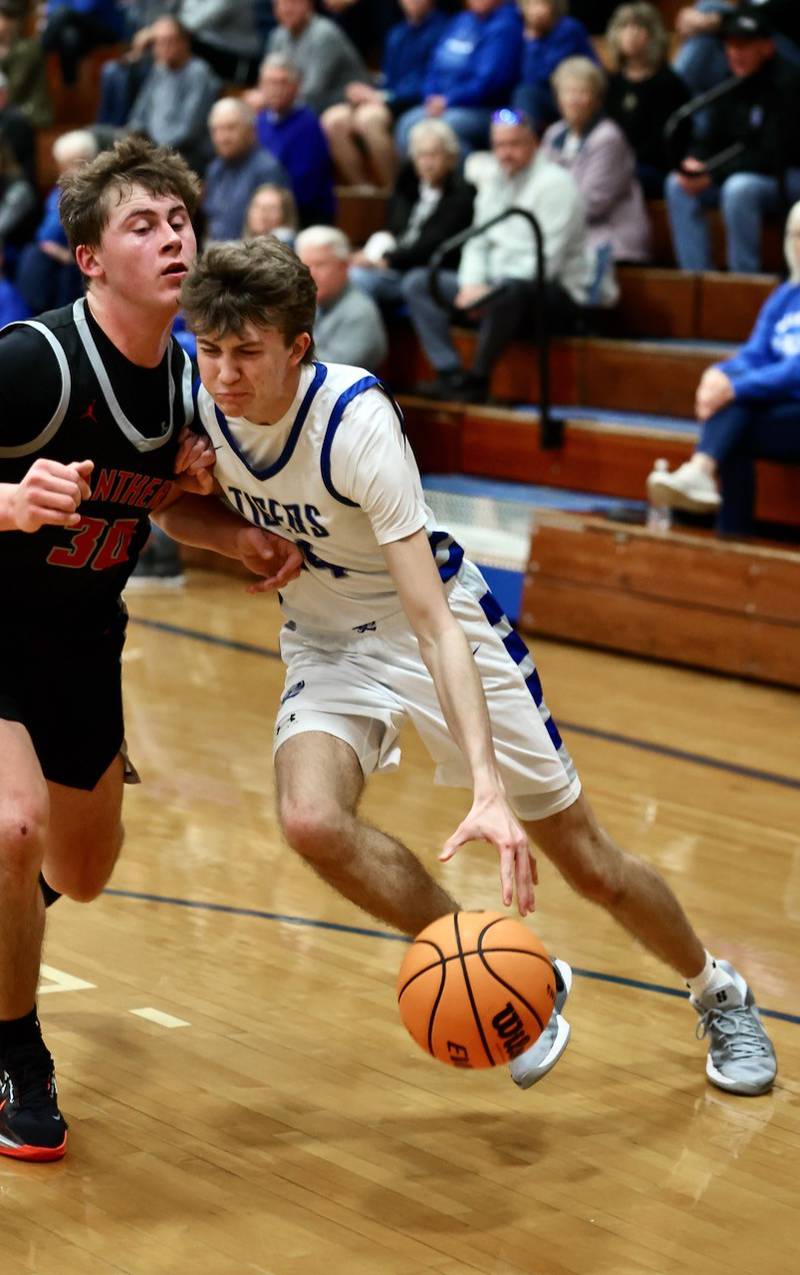 Princeton senior Jackson Mason drives on Erie-Prophetstown's Evan Steimle in Tuesday's game at Prouty Gym. The visiting Panthers won 54-46.