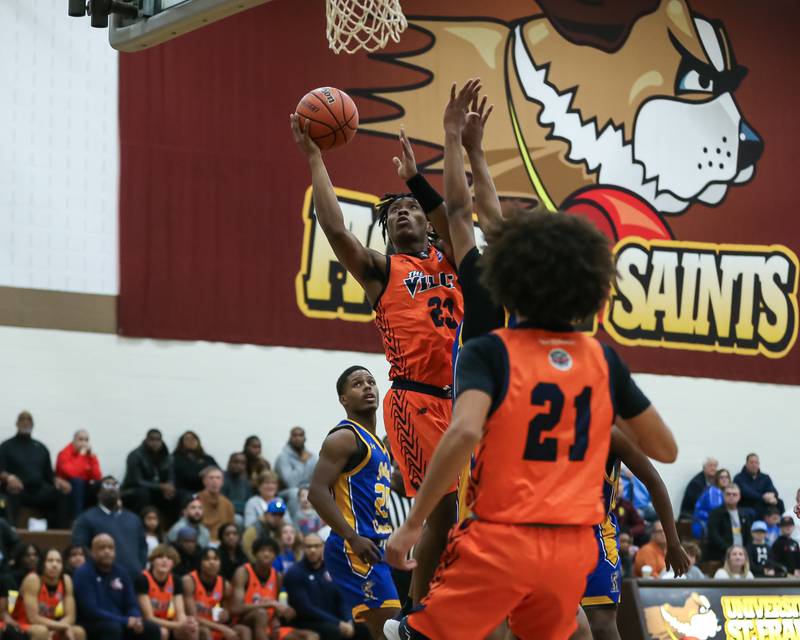 Romeoville's DJ Porter Jr (23) puts up a shot in the WJOL Tournament Championship game. Nov 25, 2023.