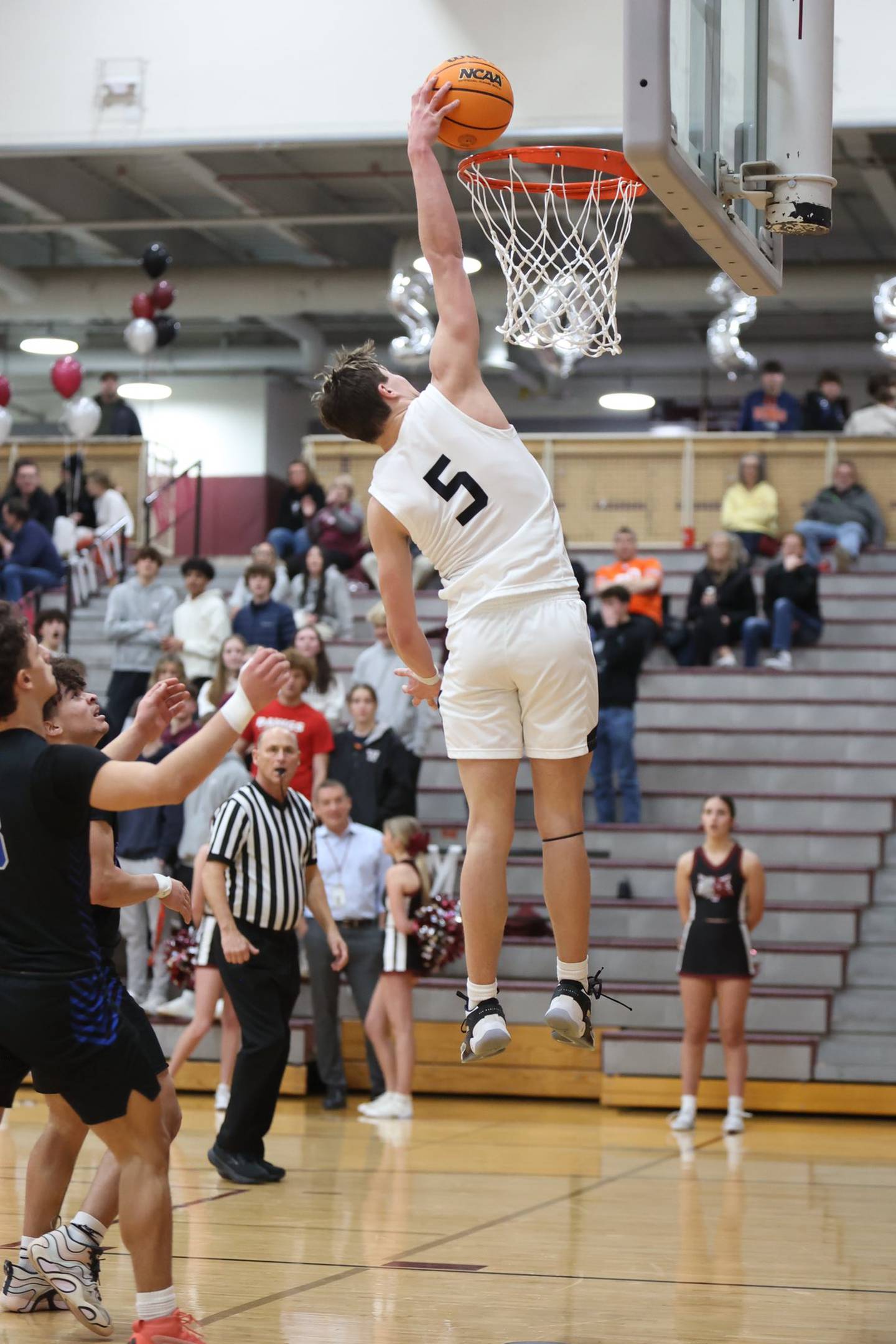 Prairie Ridge's Eli Loeding goes up for a dunk earlier this season at Prairie Ridge High School in Crystal Lake.