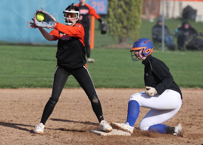 Genoa-Kingston’s Elizabeth Davis slides in with a double ahead of the Winnebago throw during their game Monday, April 21, 2025, at Genoa-Kingston High School.