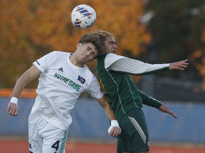 Peoria Notre Dame's Thomas Graham heads the ball away from Crystal Lake South's Ali Ahmed during the IHSA Class 2A state championship soccer match on Saturday, Nov. 4, 2023, at Hoffman Estates High School.