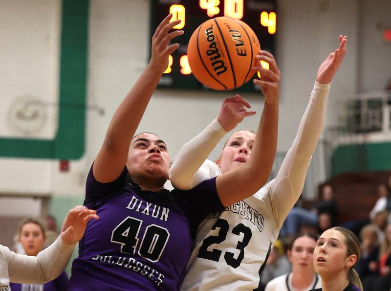 Dixon’s Hallie Williamson and Kaneland's Kendra Brown go after a rebound during their Class 3A sectional semifinal game Tuesday, Feb. 25, 2025, at Boylan Catholic High School in Rockford.
