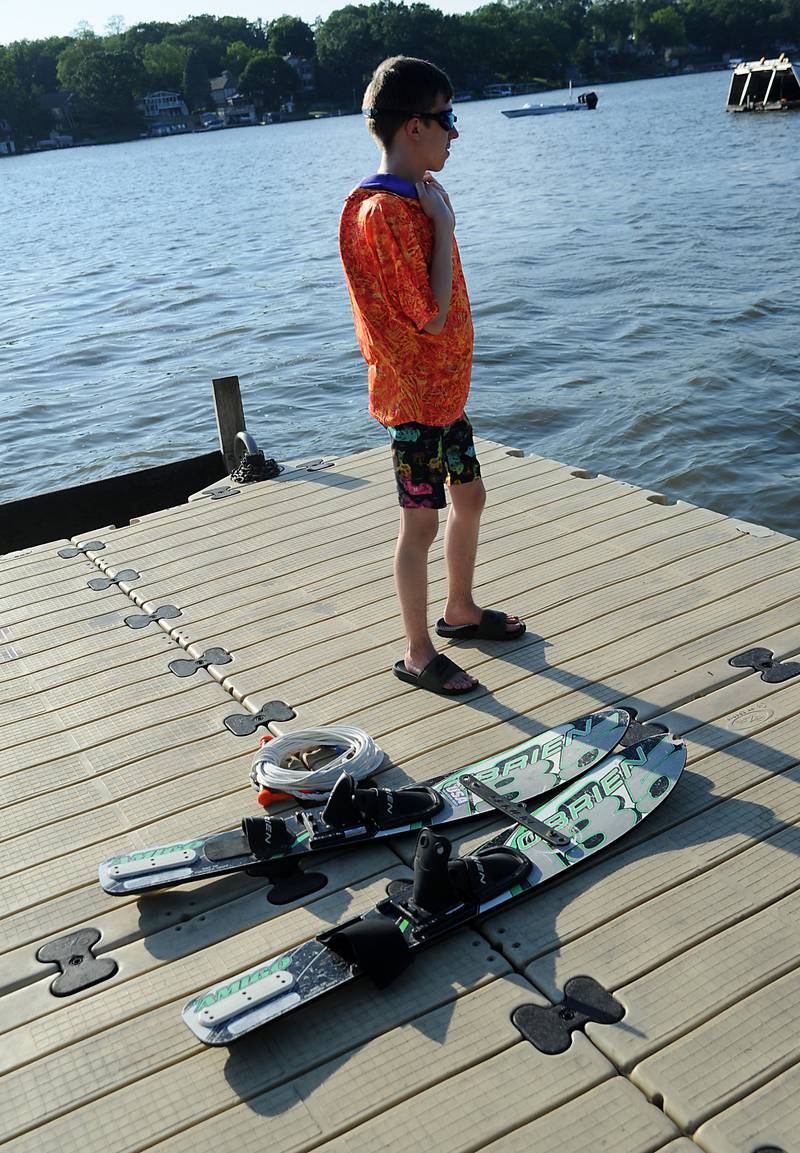 Brock Keith waits for his turn to water ski Tuesday, June 21, 2022, as part of the Wonder Lake Water Ski Show Team and Northern Illinois Special Recreation Association’s show on Wonder Lake. The performance was the end of the team’s learn to ski clinic. Members of ski team have constructed adaptive water ski equipment, which has proven year after year to be successful in allowing every participant to be able to water ski.