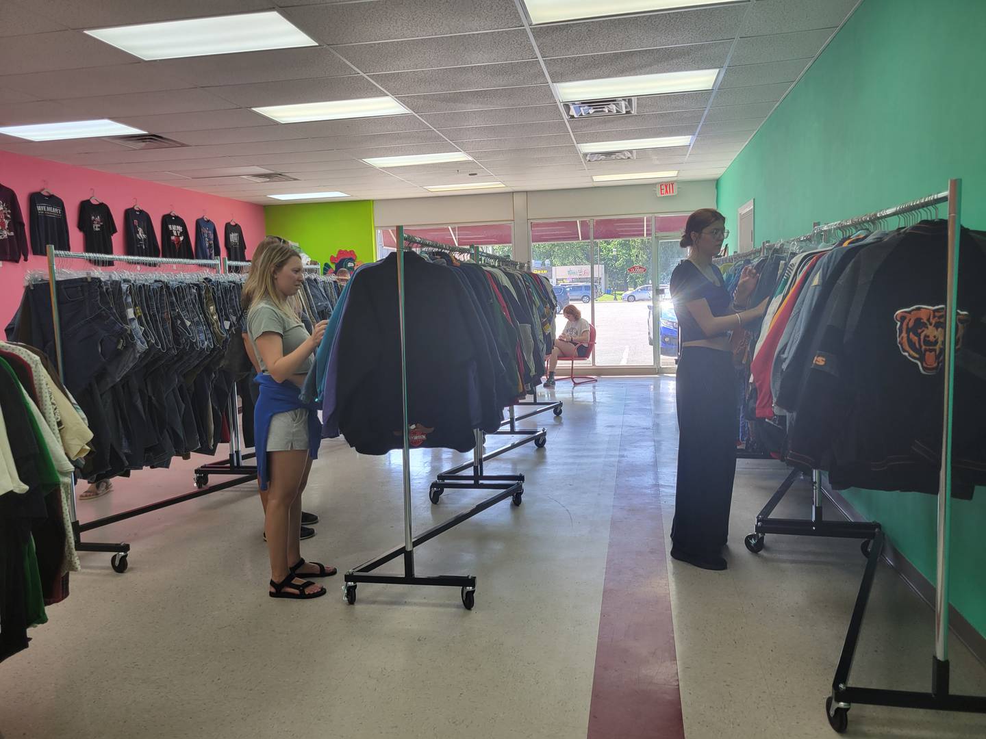 Customers browse the racks of Glue Man Vintage & Records in Bourbonnais during its grand opening May 16, 2025.