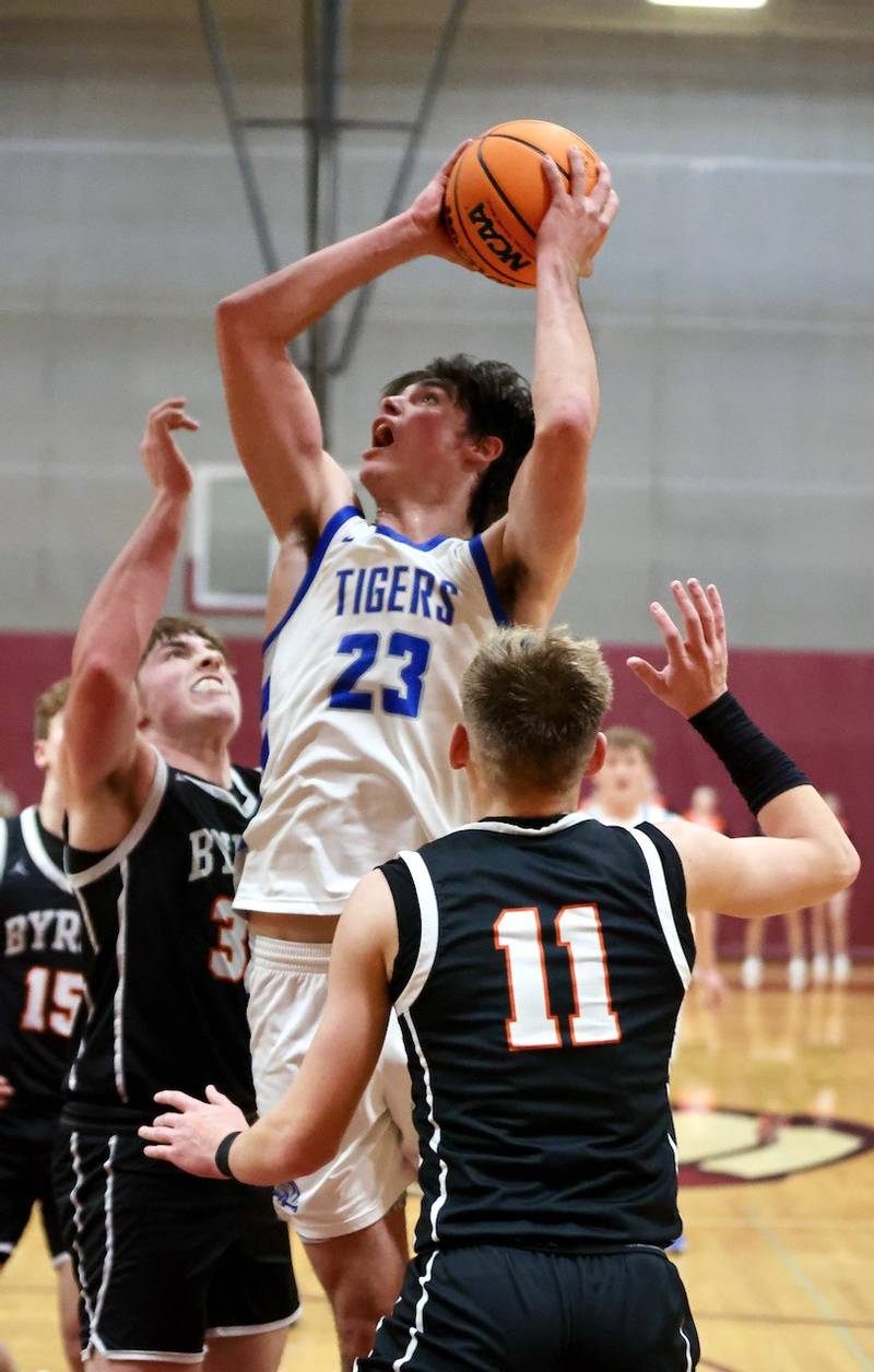 Princeton's Noah LaPorte shoots over Byron's Caden Considine and Casen Newton in Wednesday's sectional semifinals at Marengo. Princeton won 46-42 to advance to Friday's championship against Rock Falls.