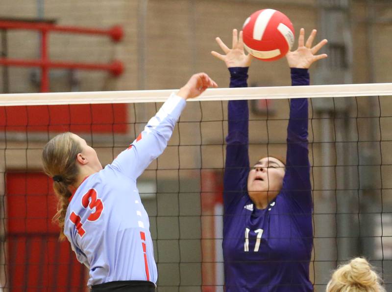 Ottawa's Ayla Dorsey sends a spike past Plano's Rita Lauro on Thursday, Aug. 31, 2023 in Kingman Gym at Ottawa High School.