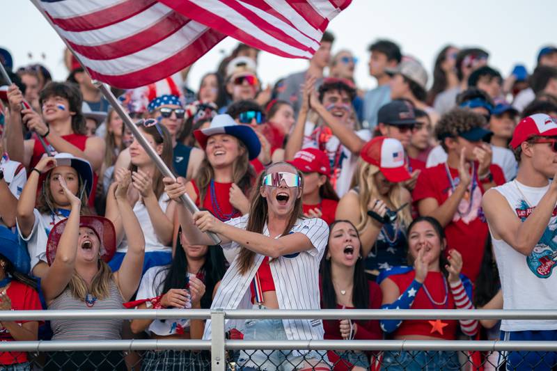Downers Grove South fans cheer on their team prior to kickoff against Downers Grove North at Downers Grove North High School on Friday, Sep 9, 2022.