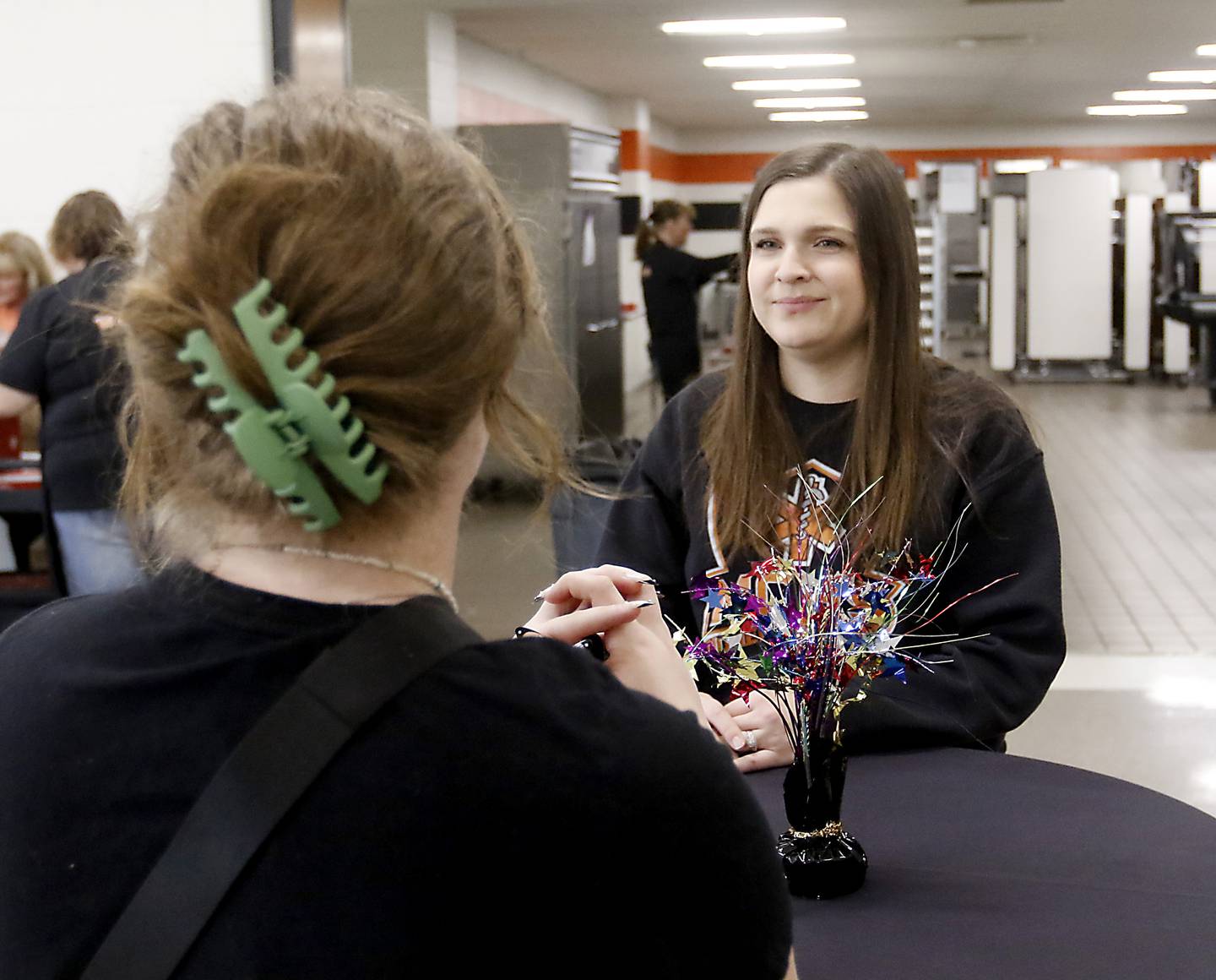 Teacher Leah Pelletier talks with student Cooper Ten Bruin on Friday, April 28, 2023, at McHenry High School.