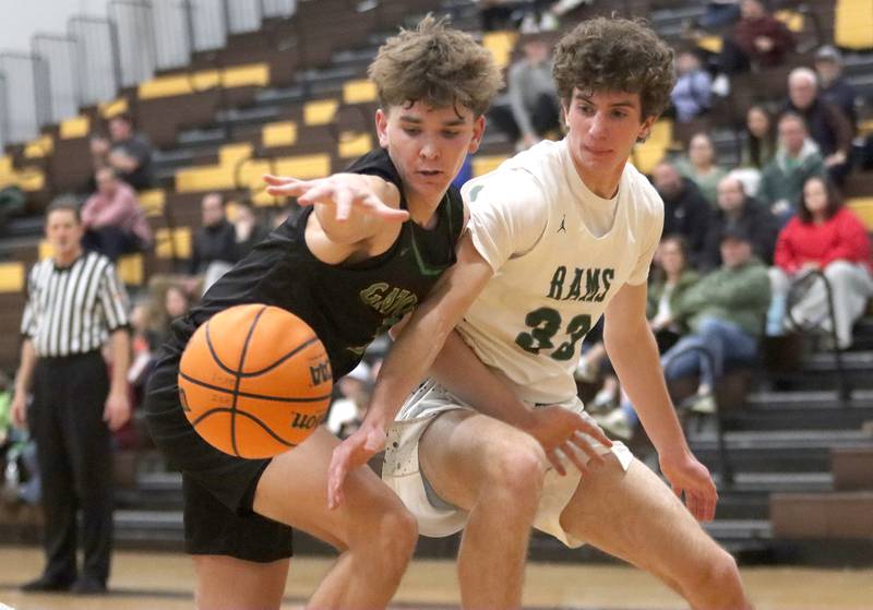 Crystal Lake South’s Nick Stowasser, left, battles Grayslake Central’s Mitchell Ross during Hinkle Holiday Classic varsity boys basketball tournament action on Thursday, Dec. 26, 2024 at Jacobs High School in Algonquin.