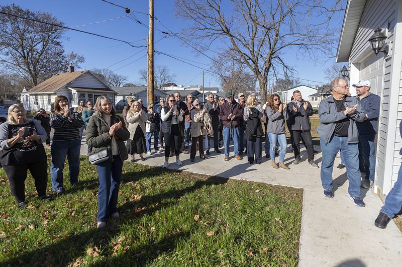 Volunteers and support staff celebrate the 2025 completion of Dixon Habitat for Humanity’s 33rd built house Sunday, Nov. 23, 2025.