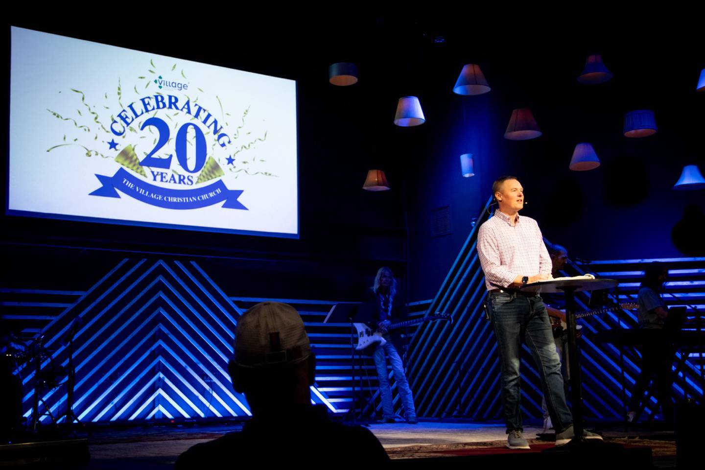 Pastor Nate Ferguson speaks to the congregation at the Village Christian Church's 20th anniversary celebration.