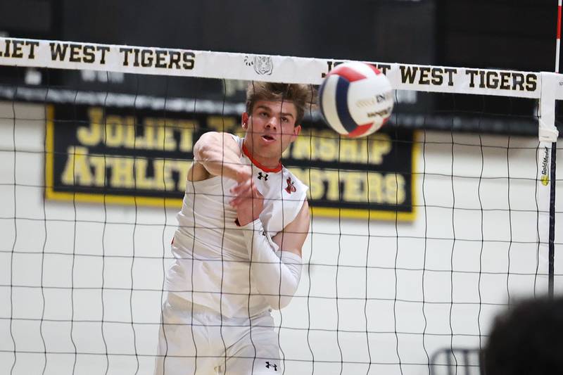 Lincoln-Way West’s Connor Studer powers a shot against Joliet Central in the Joliet West Regional Quarter-finals on Monday, May 22, 2023, in Joliet.