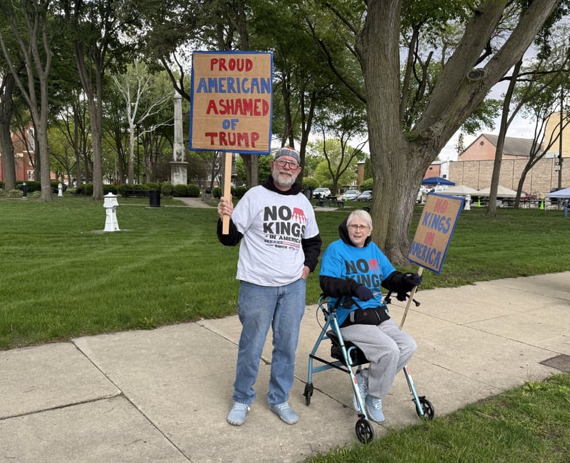Joe and Mary Shevlin, Peru residents, participating in Friday night's "May Day Rally" at Washington Square Park in Ottawa.