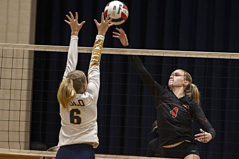 Fulton’s Ava Bowen spikes the ball over the net against Polo’s Laynie Mandrell Thursday, Sept. 14, 2023 in Polo.