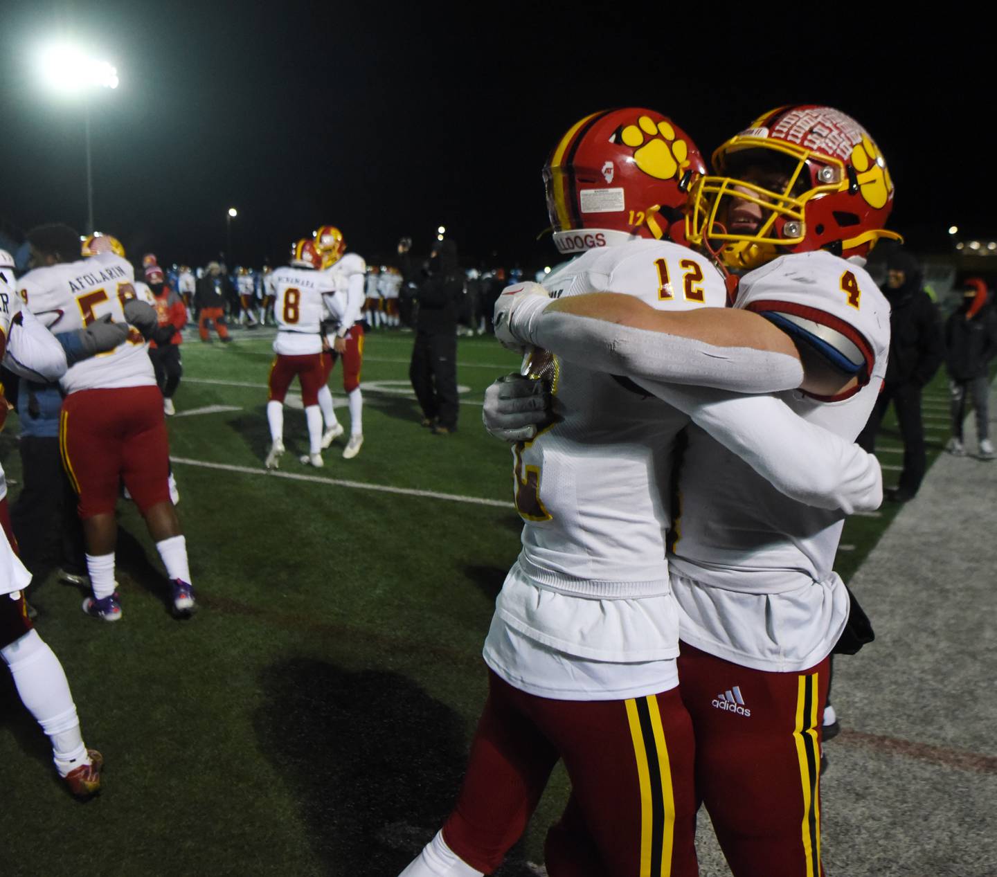 Joe Lewnard/jlewnard@dailyherald.com
Batavia’s Luke Alwin, left, and Charlie Whelpley celebrate the Bulldogs’ 24-7 voctory over Lake Zurich during the Class 7A football semifinal in Lake Zurich Saturday.