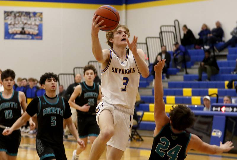 Johnsburg's Dylan Schmidt drives to the basket against Woodstock North's Jay Zinnen during a Kishwaukee River Conference boys basketball game Wednesday, Jan. 18, 2023, at Johnsburg High School.