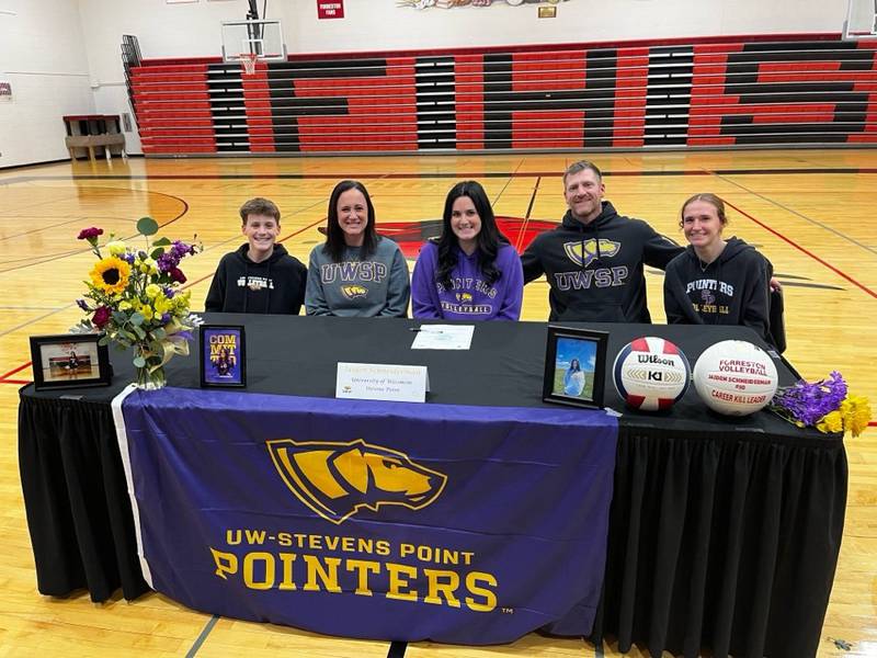Jaiden Schneiderman, daughter of Nick and Andrea Schneiderman, (center) signed a letter of intent to play volleyball at University of Wisconsin-Stevens Point.