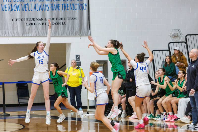 York's Avery Larma shoots a game tying three pointer at the end of the 4th quarter at the Class 4A Regional Final on Thursday, Feb.19,2026 in St. Charles.