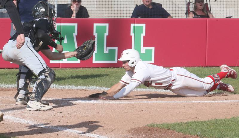 L-P's Adrian Arzola slides into the tag by Kaneland catcher Nate Campbell on Tuesday, May 13, 2025 at Huby Sarver Field at the L-P Athletic Complex in La Salle.
