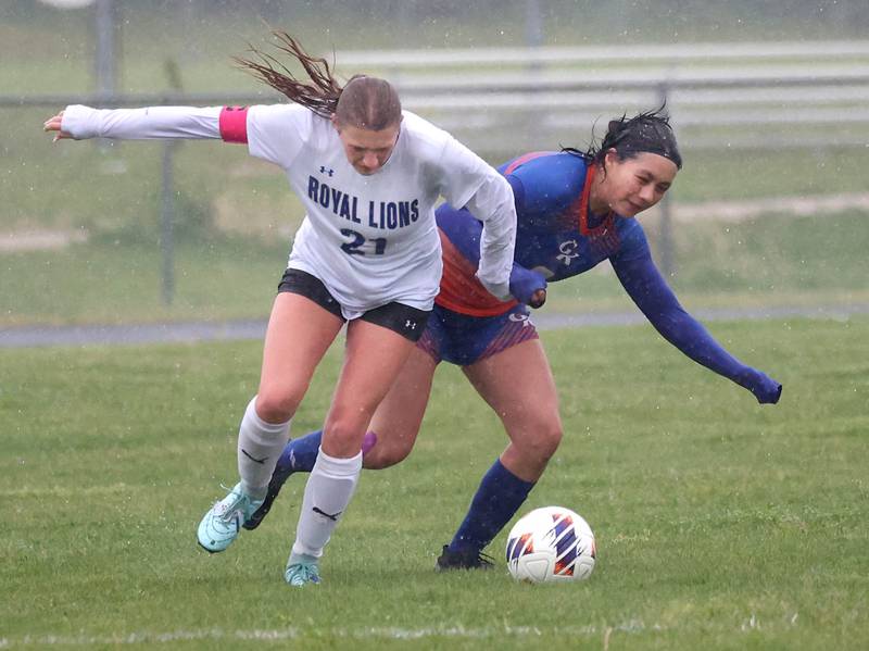 Genoa-Kingston's Dulce Ibarra (right) and Rockford Christian's Lydia Sherburne get tangled up going after the ball Tuesday, May 20, 2025, during their Class 2A regional final game at Rockford Christian High School.