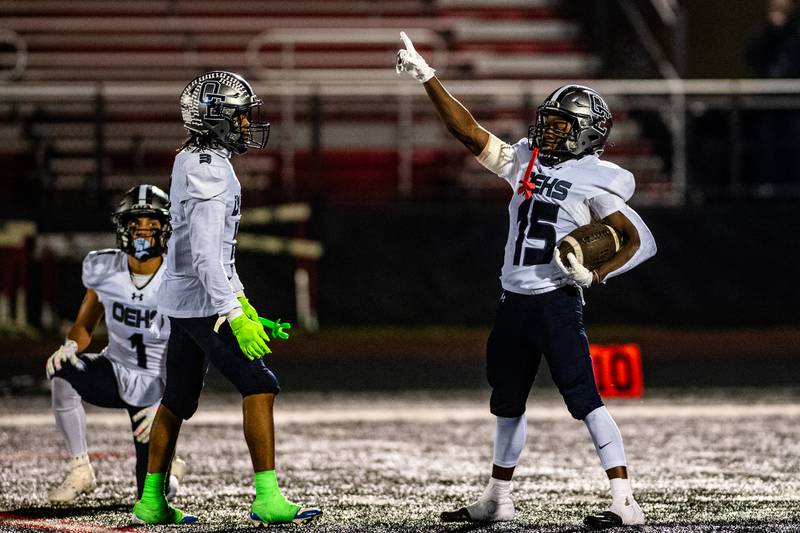 Oswego East's Jamari McKay celebrates his interception during a game against Bolingbrook on Friday Oct. 31, 2025 at Bolingbrook High School