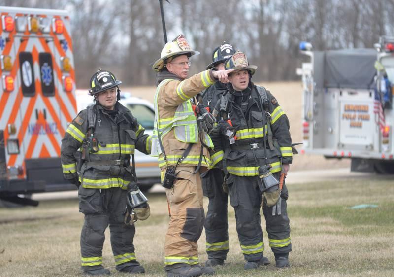 Polo Fire Chif Jim Ports directs firefighters during a structure fire at 6727 W. Henry Road, southeast of Polo, on Wednesday, March 26, 2025. Several departments responded to the garage fire at the rural residence. No injuries were reported.