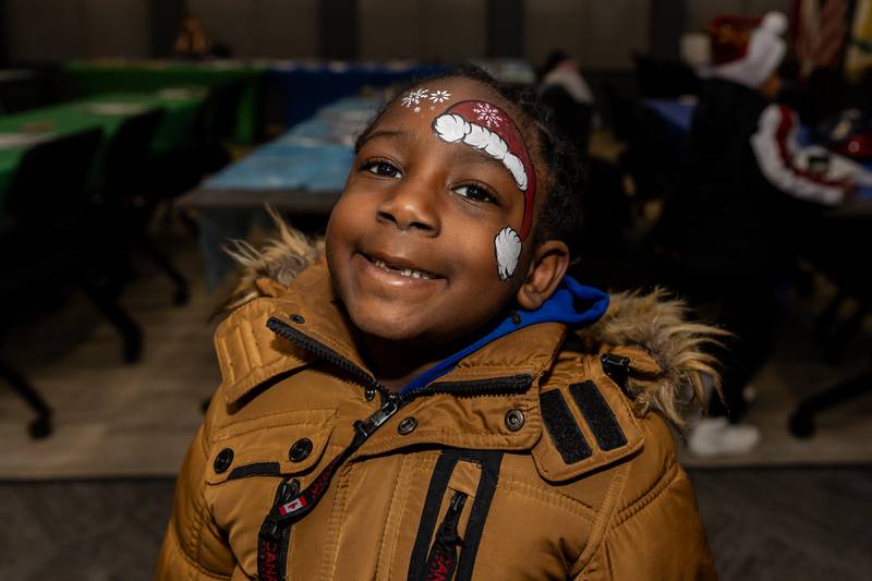 Joliet resident Nehemiah Adjekum shows-off his smile and his festive face-paint during Winterfest at Crest Hill City Center on Nov. 30, 2024.
