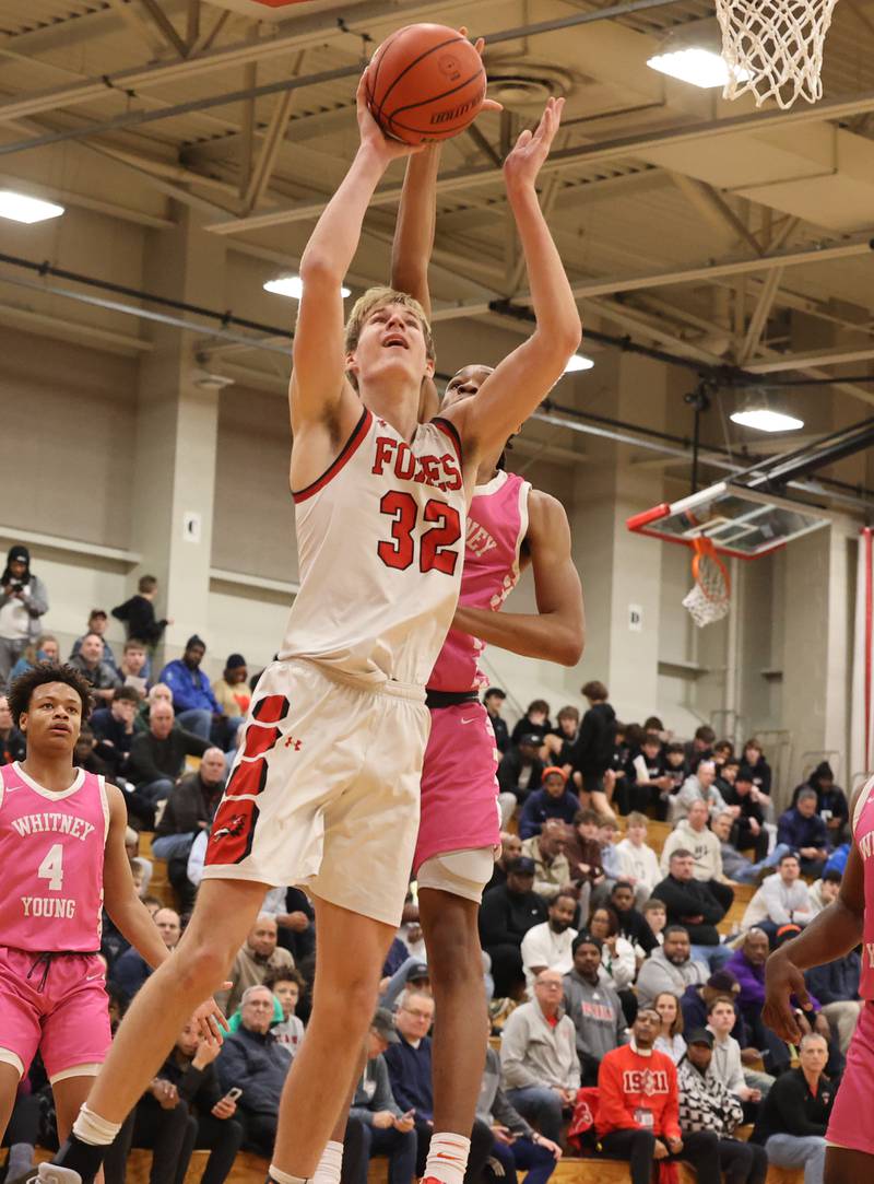 Yorkville’s Jason Jakstys (32) takes it to the basket against Whitney Young during the When Sides Collide Shootout on Saturday, Jan. 20, 2024 in Lisle, IL.