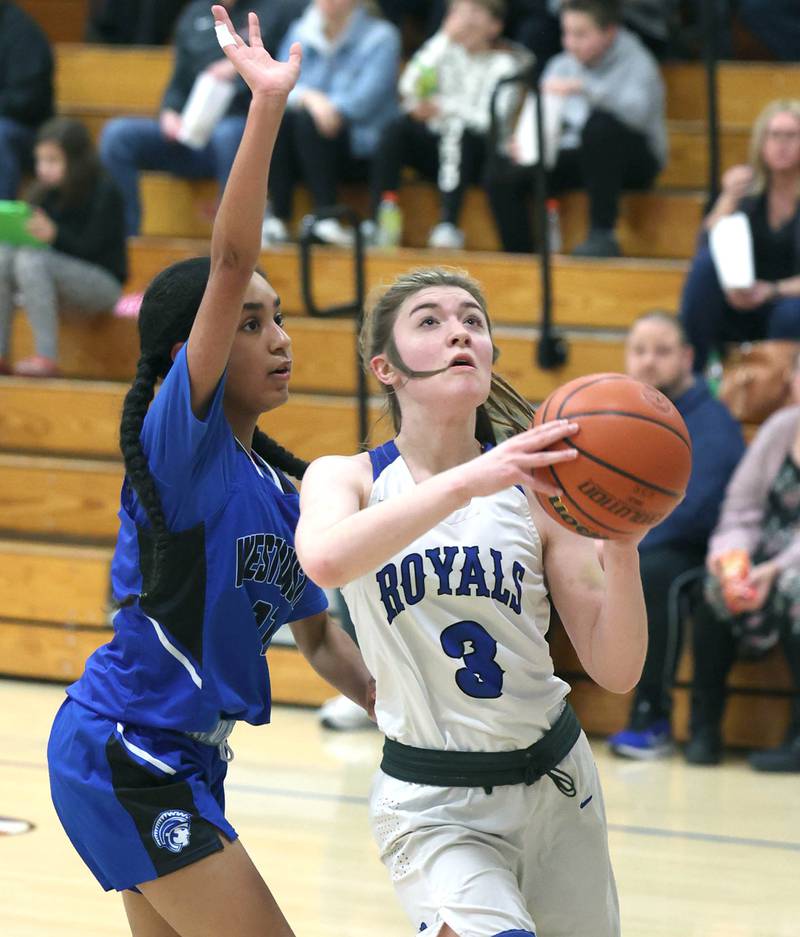 Hinckley-Big Rock's Kylee Hellebrand gets to the basket ahead of Westminster Christian's Beyah Richardson during their regional semifinal game Monday, Feb. 13, 2023, at Hinckley-Big Rock High School.