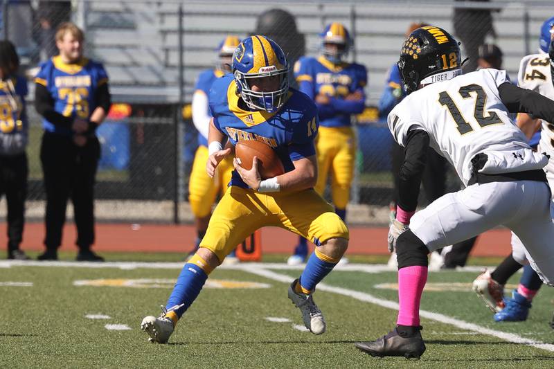 Joliet Central’s John Stasiak makes a cut against Joliet West in the cross town rival matchup on Saturday.