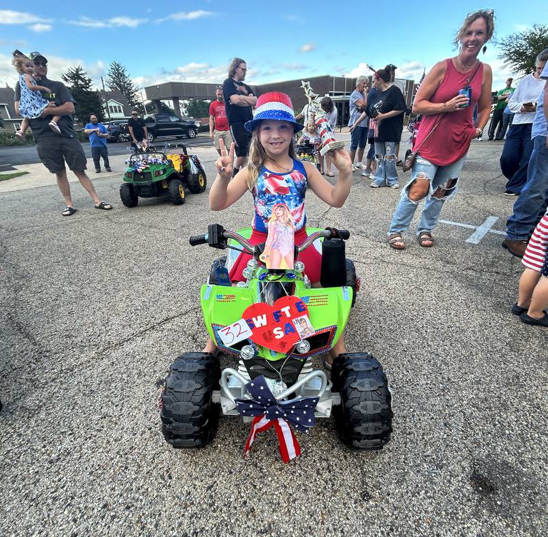 Aurora Mills, 6, of Byron, decorated her ATV in a Taylor Swift theme for the Kiddie Parade at the Let Freedom Ring festival in Mt. Morris on Friday, July 5, 2024.