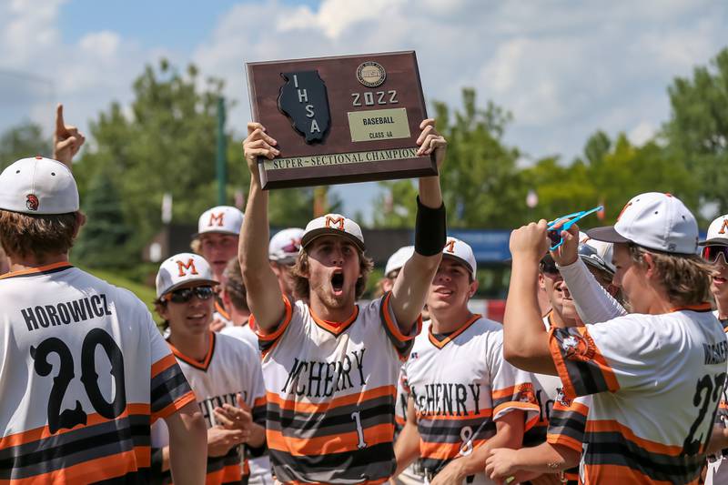 McHenry celebrates with the Class 4A Supersectional game plaque after defeating York. June 7, 2022.