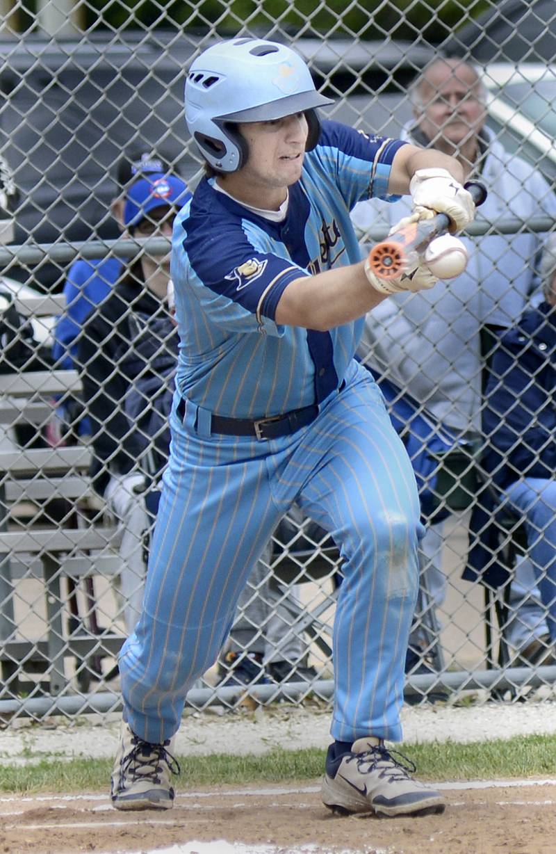 Marquette’s Alex Nonotney says down at bunt to advance a runner against Newark Saturday at Masinelli Field.