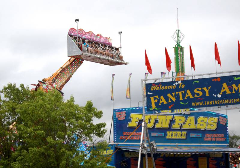 Riders are suspended mid-air during the 156th Annual Kane County Fair on Thursday, July 17, 2025 in St. Charles. The fair runs through Sunday, July 20, 2025.