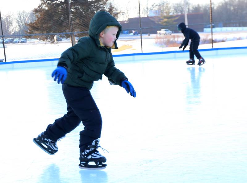 Griffin and Marshall Gray of Princeton skate on the ice rink at Alexander Park on Thursday, Feb. 2, 2023 in Princeton.
