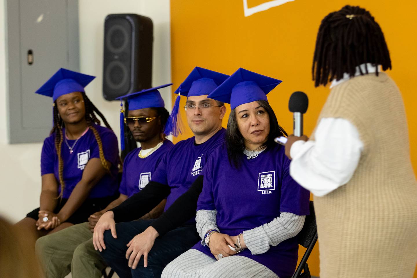 Connie Jackson, Jerweon Sharpe Sr., Alvaro Trejos, and Bernita Perkins listen to remarks from keynote speaker, LaDora Robinson-Locke ( Northern Illinois Food Bank, Chief People Officer), during the S.E.E.D. graduation at the Northern Illinois Food Bank South Suburban Center in Joliet on March 14, 2024.