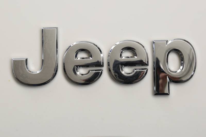 FILE - This is the Jeep logo on the front end of a Jeep Cherokee on display at the Pittsburgh International Auto Show in Pittsburgh Thursday, Feb. 11, 2016.  Stellantis is telling owners of nearly 220,000 Jeep Cherokee SUVs worldwide, Tuesday, May 16, 2023,  to park them outdoors and away from other vehicles because the power liftgates can catch fire even when the engines are off. The company is recalling certain Jeep Cherokees from the 2014 through 2016 model years.   (AP Photo/Gene J. Puskar, File)