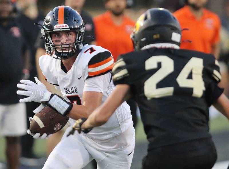 DeKalb's Adrien McVicar looks to get past Sycamore's William Stewart Friday Aug. 27, 2021, during the First National Challenge in Huskie Stadium at Northern Illinois University in DeKalb. Friday was the first game of the 2021 season for both schools.