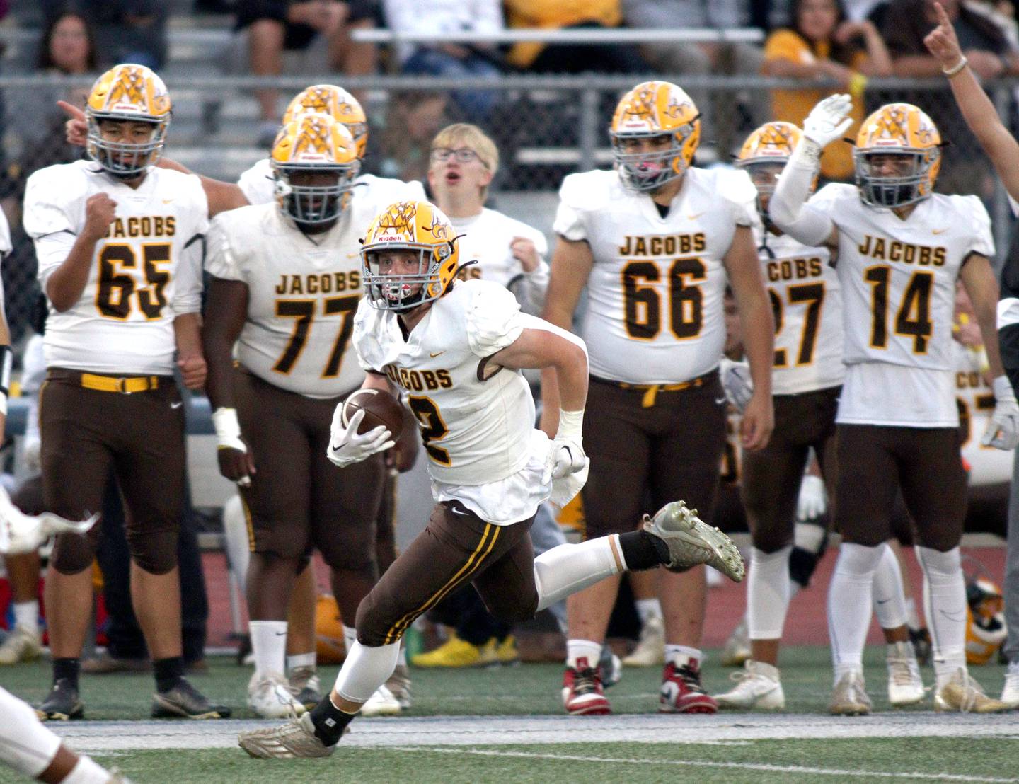 Jacobs’ Caden DuMelle runs the ball in varsity football in Huntley Friday night.