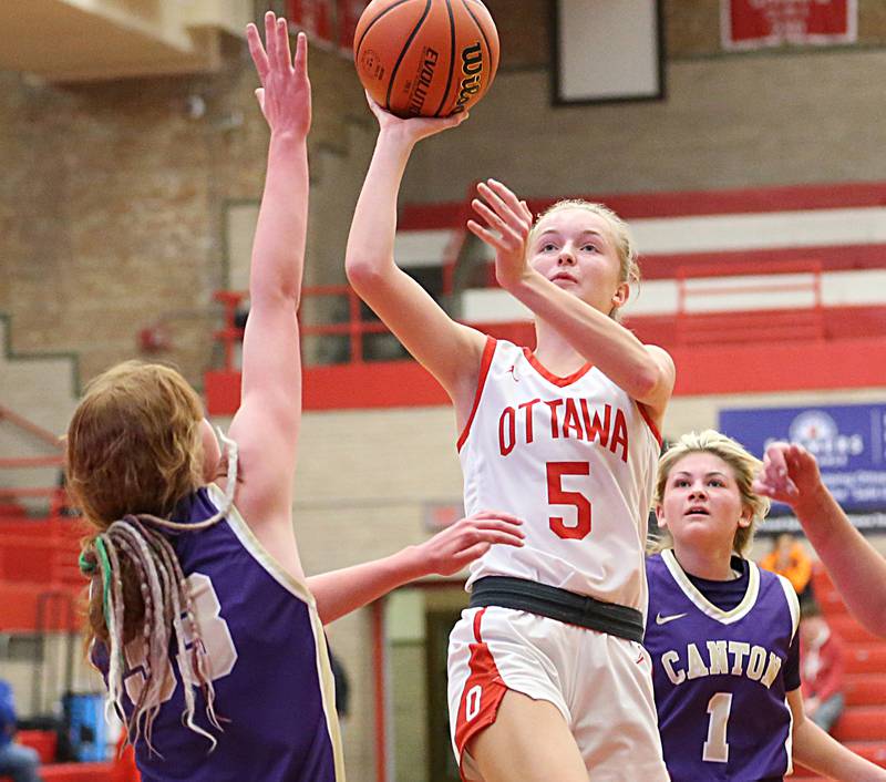 Ottawa's Grace Carroll runs into the lane to shoot a jump shot over Canton's Milly Oswald during the Lady Pirate Holiday Tournament on Wednesday, Dec. 21, 2022 in Ottawa.