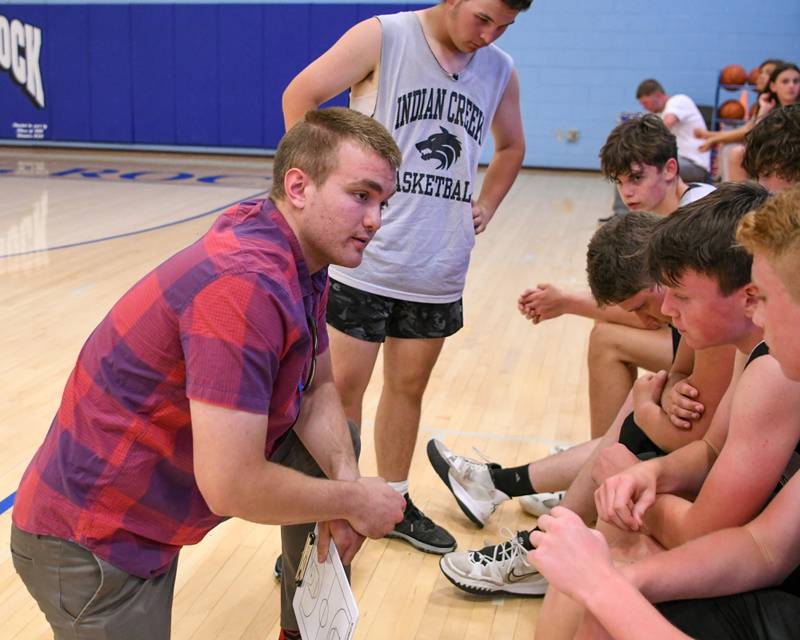 Indian Creek basketball coach Nolan Govig talks to the players before the start of the summer scrimmage on Tuesday June 28th.