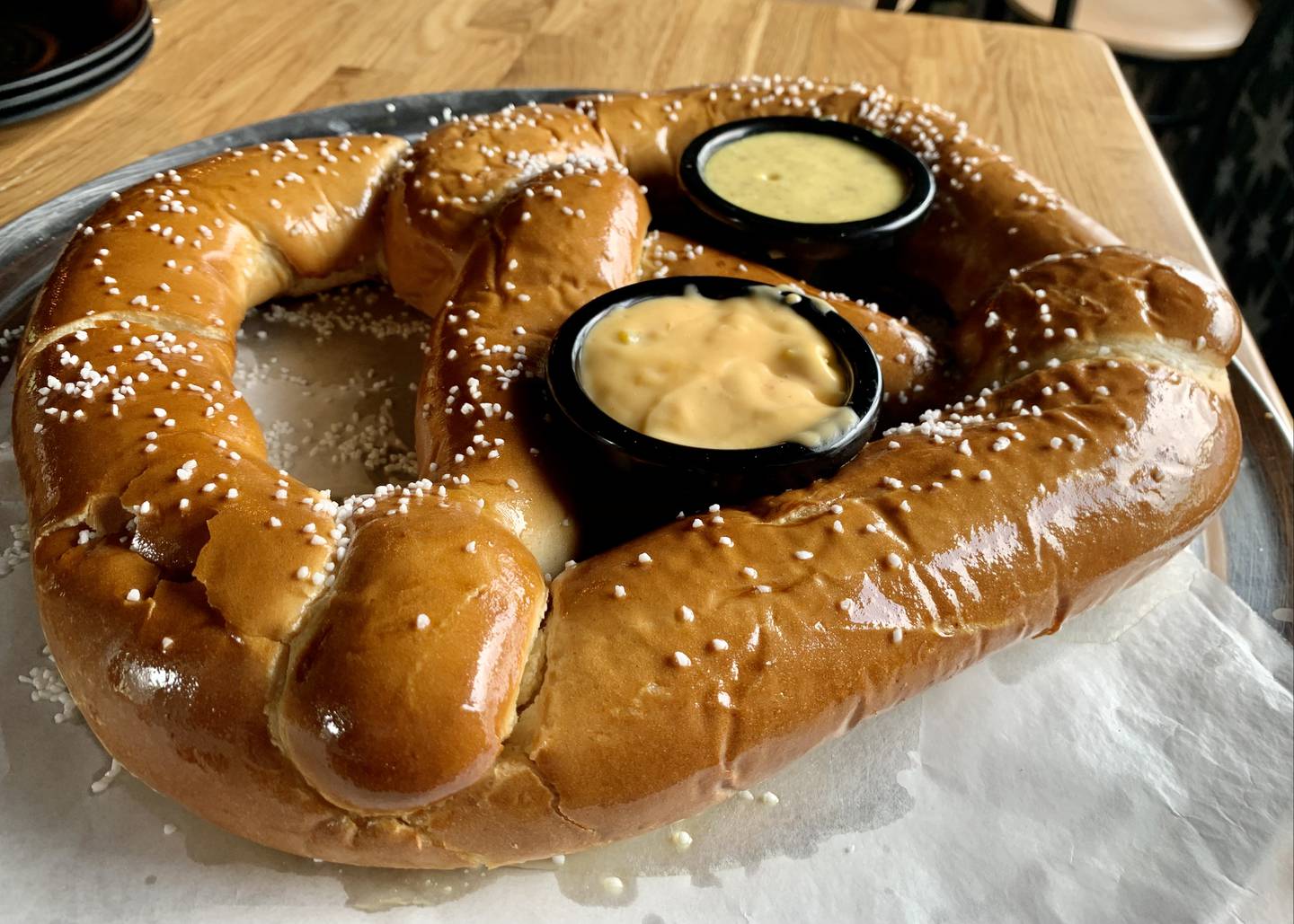 The freshly baked Bavarian pretzel at Dakotas is an appetizer that must be shared.  The pretzel is over a foot in diameter and comes with honey mustard sauces and pickled jalapeno cheese.