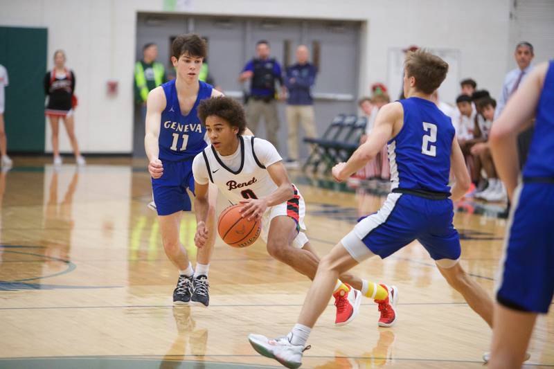 Benet's Brayden Fagbemi is double teamed by Geneva's Karen McNeive (11) and Michael Lawrence (2) at the Class 4A Sectional Final at Bartlett on Friday, March 3, 2023.